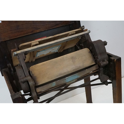 606 - Early 20th century ' Pioneer ' Oak Table and Rubber Wringer, 76cm wide x 52cm deep x 73cm high