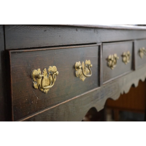 540 - 18th / Early 19th century Oak Dresser Base with three moulded drawers, shaped apron and raised on fr... 