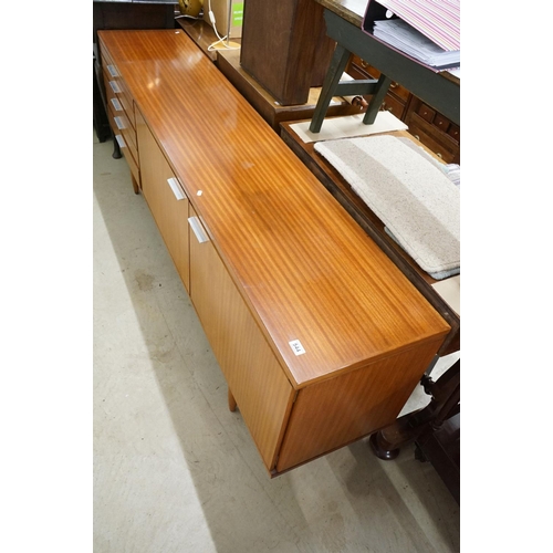 544 - Mid century Retro Teak Sideboard with an arrangement of two cupboard doors and five drawers, with ch... 