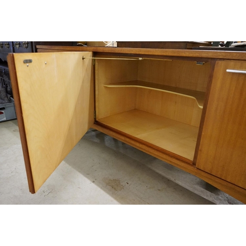 544 - Mid century Retro Teak Sideboard with an arrangement of two cupboard doors and five drawers, with ch... 