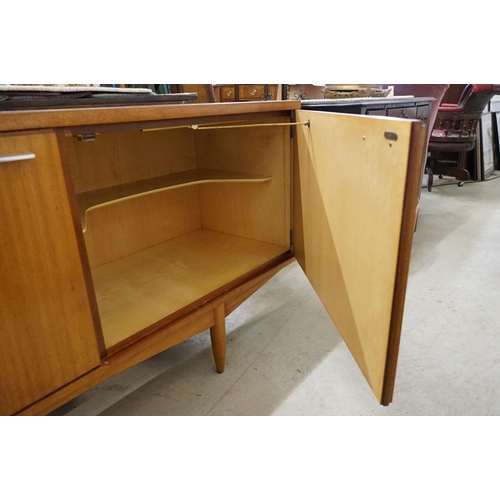 544 - Mid century Retro Teak Sideboard with an arrangement of two cupboard doors and five drawers, with ch... 