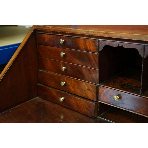 551 - George III Mahogany Bureau, the drop front opening to a fitted interior, over four long drawers, rai... 