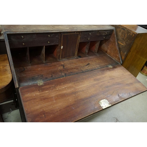 571 - George III Mahogany Bureau, the drop front opening to a fitted interior, over three long drawers, ra... 