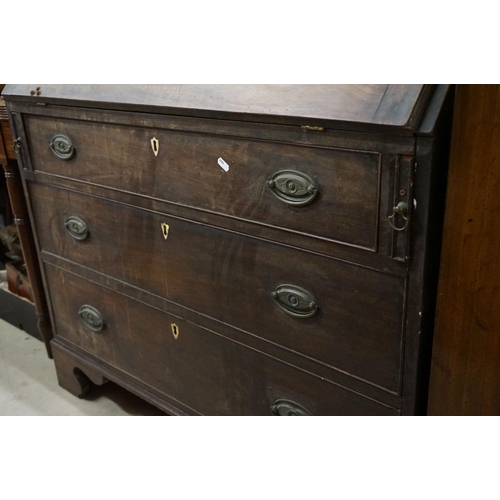 571 - George III Mahogany Bureau, the drop front opening to a fitted interior, over three long drawers, ra... 