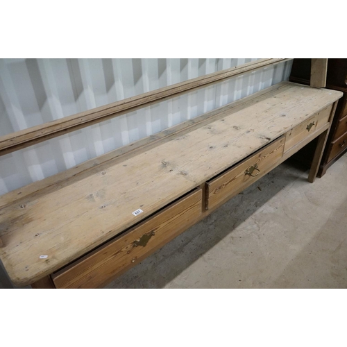 621 - 18th century Pine Dresser Base with three drawers raised on square legs, 243cm long x 52.5cm deep x ... 