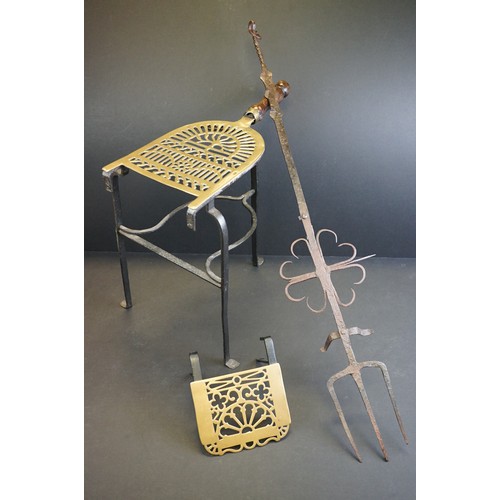 412 - A small group of brass trivets and fire side tools including a 17th century downhearth toasting fork... 