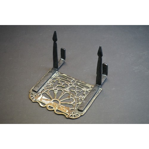 412 - A small group of brass trivets and fire side tools including a 17th century downhearth toasting fork... 