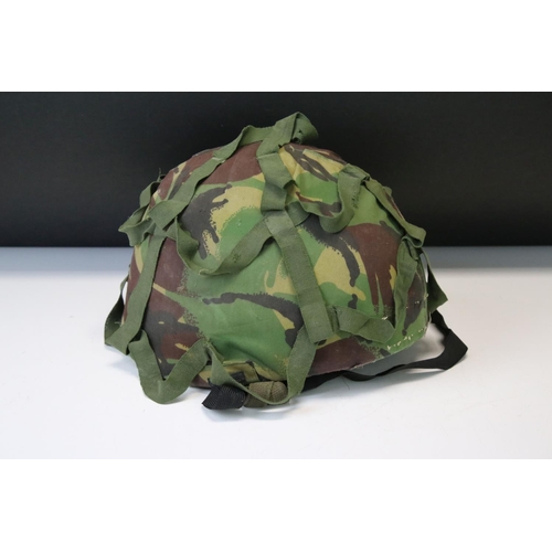 169 - A Collection Of Three Military Helmets To Include A British World War Two Brodie Example.