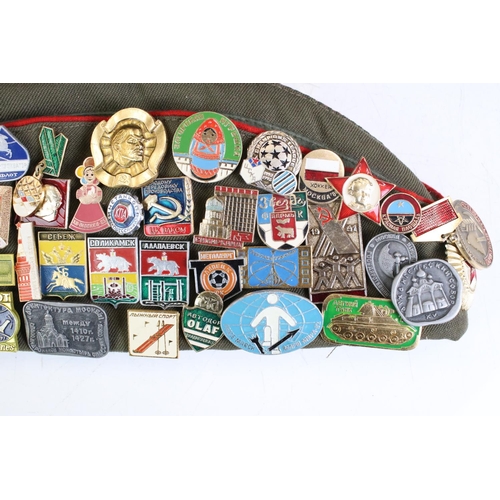 373 - A Russian Military Side / Forage Cap With A Large Quantity Of Attached Pin Badges.