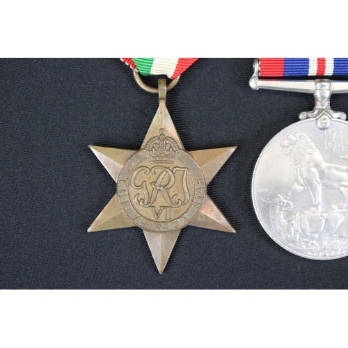 135 - A British World War Two Full Size Medal Group Of Three To Include The 1939-45 British War Medal, The... 