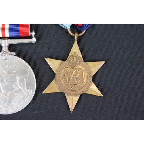 135 - A British World War Two Full Size Medal Group Of Three To Include The 1939-45 British War Medal, The... 