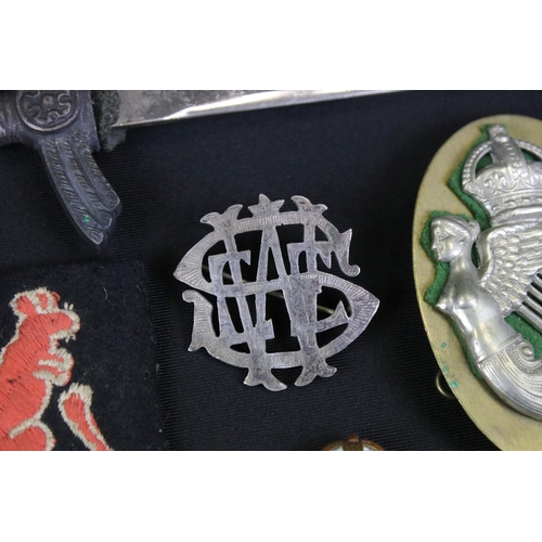 143 - A Small Collection Of Military Cloth And Metal Badges To Include Lancers & Hussars Examples.