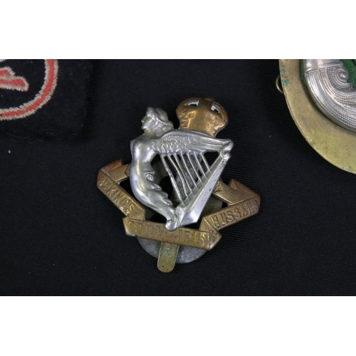 143 - A Small Collection Of Military Cloth And Metal Badges To Include Lancers & Hussars Examples.