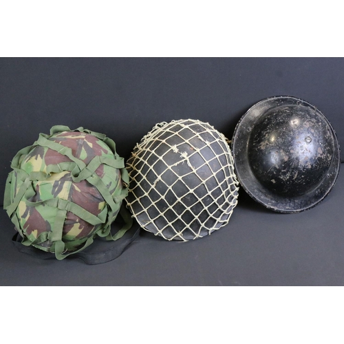 169 - A Collection Of Three Military Helmets To Include A British World War Two Brodie Example.