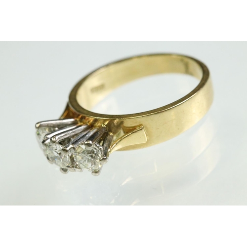 23 - Diamond three stone 18ct yellow and white gold set ring, three round brilliant cut diamonds, total d... 