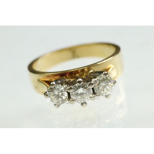 23 - Diamond three stone 18ct yellow and white gold set ring, three round brilliant cut diamonds, total d... 