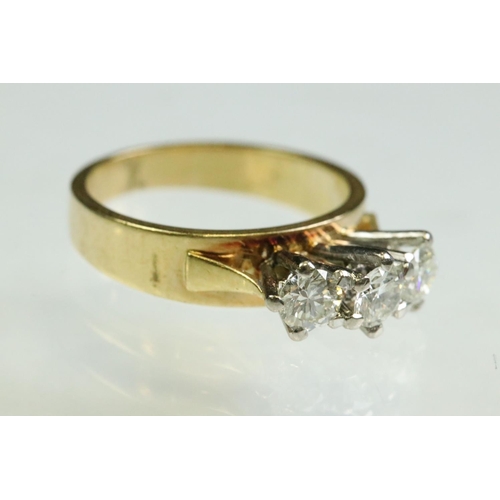 23 - Diamond three stone 18ct yellow and white gold set ring, three round brilliant cut diamonds, total d... 