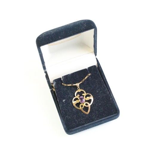 28 - Edwardian amethyst 9ct gold pendant necklace, the oval mixed cut amethyst measuring approx 7mm x 5mm... 