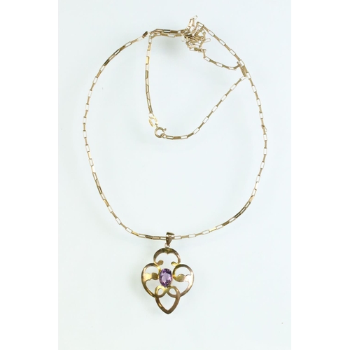 28 - Edwardian amethyst 9ct gold pendant necklace, the oval mixed cut amethyst measuring approx 7mm x 5mm... 
