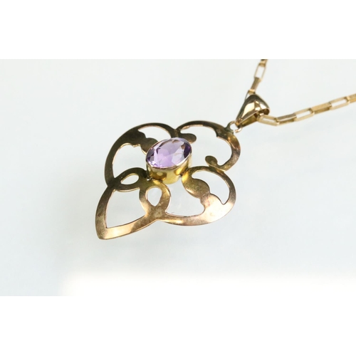 28 - Edwardian amethyst 9ct gold pendant necklace, the oval mixed cut amethyst measuring approx 7mm x 5mm... 