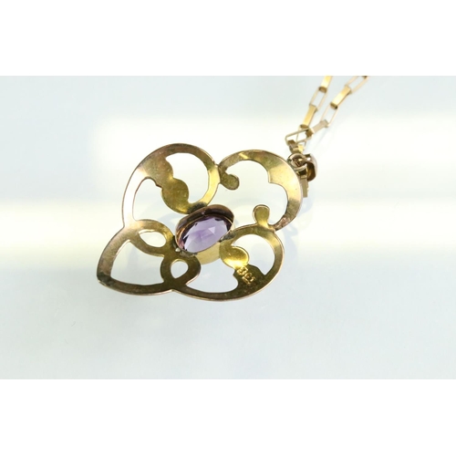 28 - Edwardian amethyst 9ct gold pendant necklace, the oval mixed cut amethyst measuring approx 7mm x 5mm... 