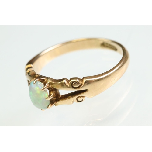 13 - Victorian opal 15ct yellow gold ring, the oval cabochon cut precious white opal displaying yellow, g... 