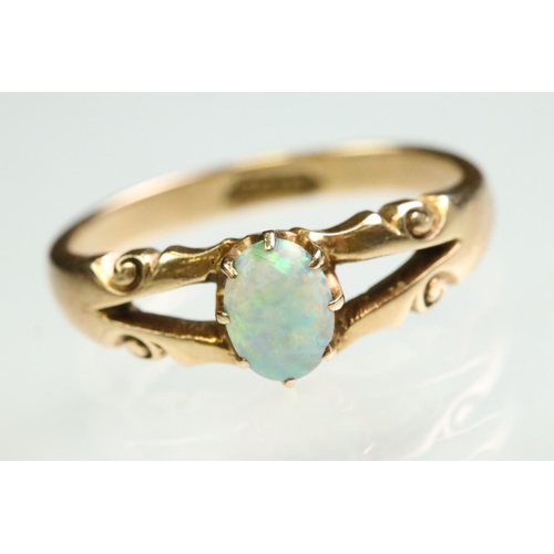 13 - Victorian opal 15ct yellow gold ring, the oval cabochon cut precious white opal displaying yellow, g... 