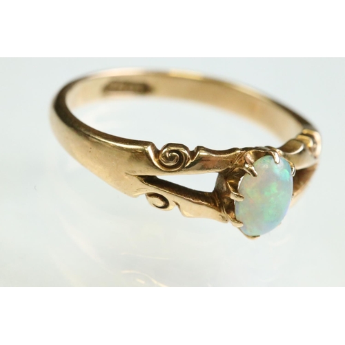 13 - Victorian opal 15ct yellow gold ring, the oval cabochon cut precious white opal displaying yellow, g... 
