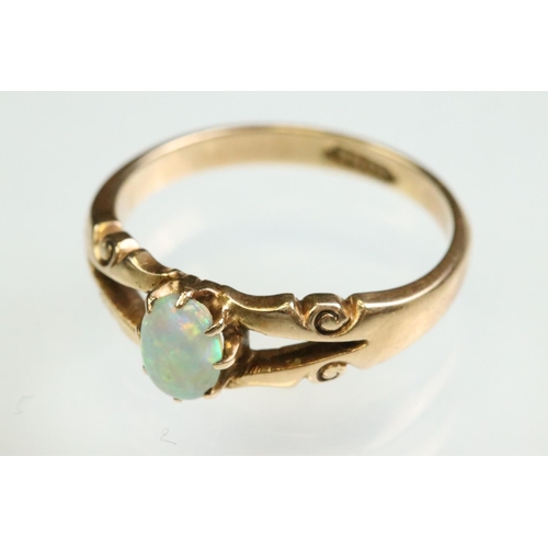 13 - Victorian opal 15ct yellow gold ring, the oval cabochon cut precious white opal displaying yellow, g... 