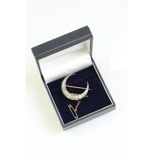 16 - 19th century diamond unmarked yellow and rose gold silver set crescent brooch, seventeen graduated a... 
