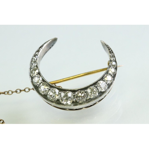 16 - 19th century diamond unmarked yellow and rose gold silver set crescent brooch, seventeen graduated a... 