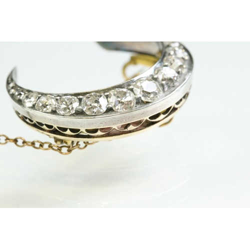 16 - 19th century diamond unmarked yellow and rose gold silver set crescent brooch, seventeen graduated a... 