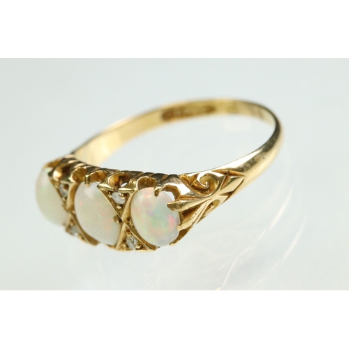 38 - Opal and diamond yellow gold ring, three graduated oval cabochon cut precious white opals, displayin... 