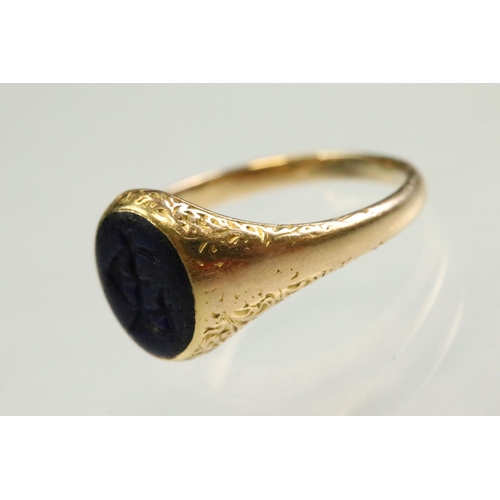 46 - Mid 19th century lapis lazuli unmarked yellow gold signet ring, the oval lapis lazuli panel measurin... 