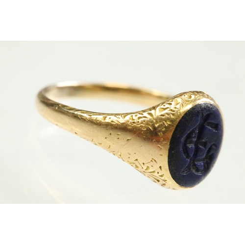 46 - Mid 19th century lapis lazuli unmarked yellow gold signet ring, the oval lapis lazuli panel measurin... 