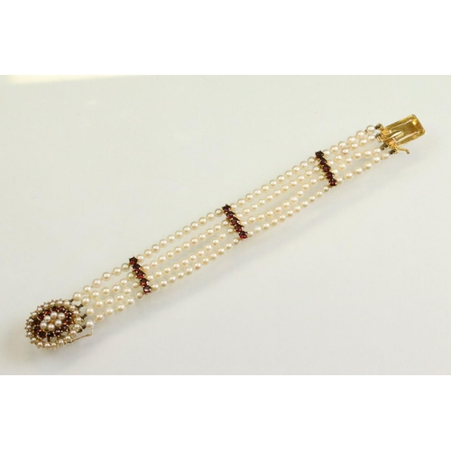54 - Garnet and pearl 9ct yellow gold bracelet, the oval clasp set with two rows of cream cultured pearls... 