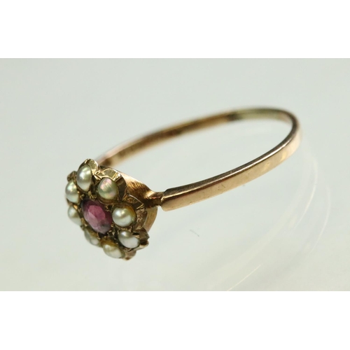 58 - Victorian garnet and pearl 9ct rose gold flower head ring,  pink-purple round mixed cut garnet to th... 