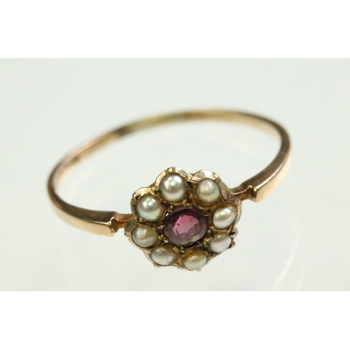 58 - Victorian garnet and pearl 9ct rose gold flower head ring,  pink-purple round mixed cut garnet to th... 
