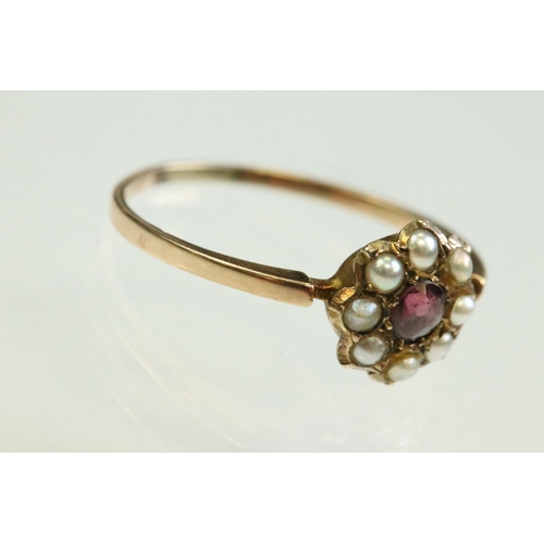58 - Victorian garnet and pearl 9ct rose gold flower head ring,  pink-purple round mixed cut garnet to th... 
