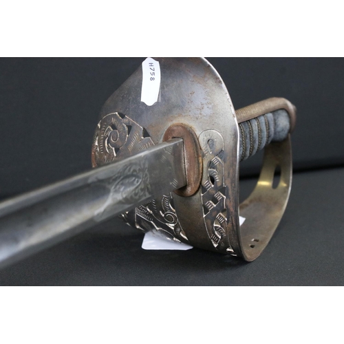 154 - A British Military King George VI Cavalry Officers Sword Complete With Leather Scabbard.