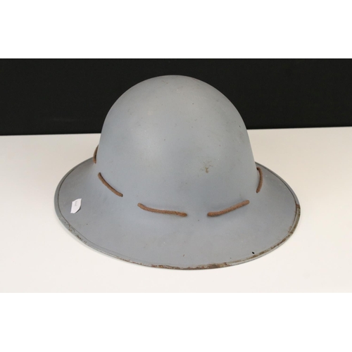 75 - A World War Two Allied Forces Overpainted Steel Helmet Complete With Liner.