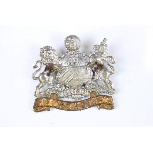 187 - A British Manchester Regiment Bi Metal Military Cap Badge, Complete With Twin Loop Fixings To Verso.