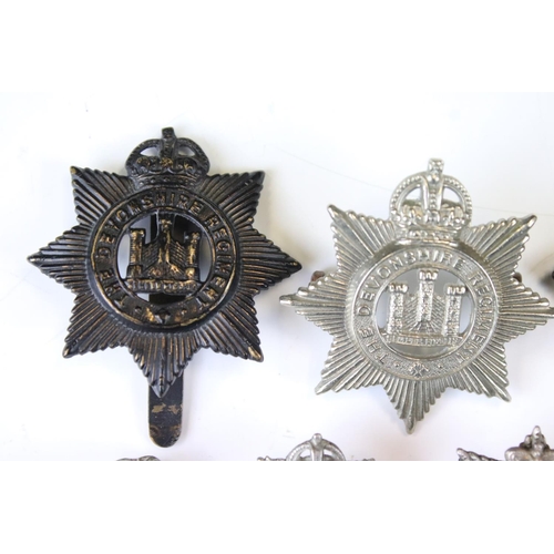 206 - A Collection Of British Military The Devonshire Regiment Cap And Collar Badges, Mainly Kings Crown E... 