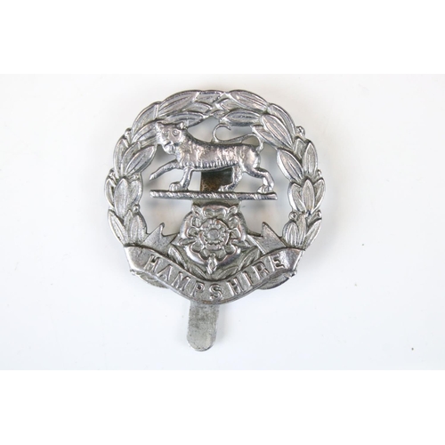 207 - A British Military The Hampshire Regiment White Metal Cap Badge, Complete With Slider Fixing To The ... 