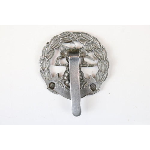 207 - A British Military The Hampshire Regiment White Metal Cap Badge, Complete With Slider Fixing To The ... 