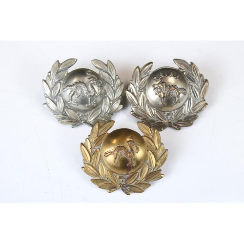 214 - A Collection Of Three British Military The Border Regiment Collar Badges, To Include Brass And White... 