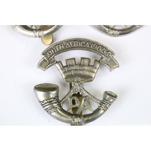 219 - A Collection Of Four Somerset Light Infantry Regiment White Metal Cap Badges, To Include South Afric... 