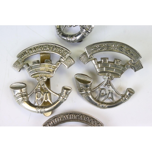 219 - A Collection Of Four Somerset Light Infantry Regiment White Metal Cap Badges, To Include South Afric... 