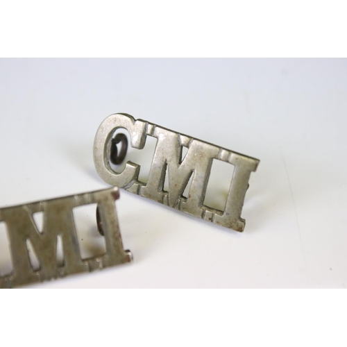 235 - A Pair Of Ceylon Mounted Infantry White Metal Shoulder Titles, Both Complete With Twin Loop Fixings ... 