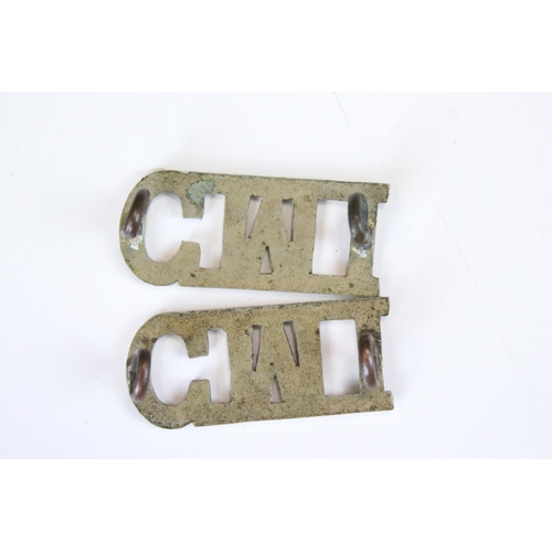 235 - A Pair Of Ceylon Mounted Infantry White Metal Shoulder Titles, Both Complete With Twin Loop Fixings ... 